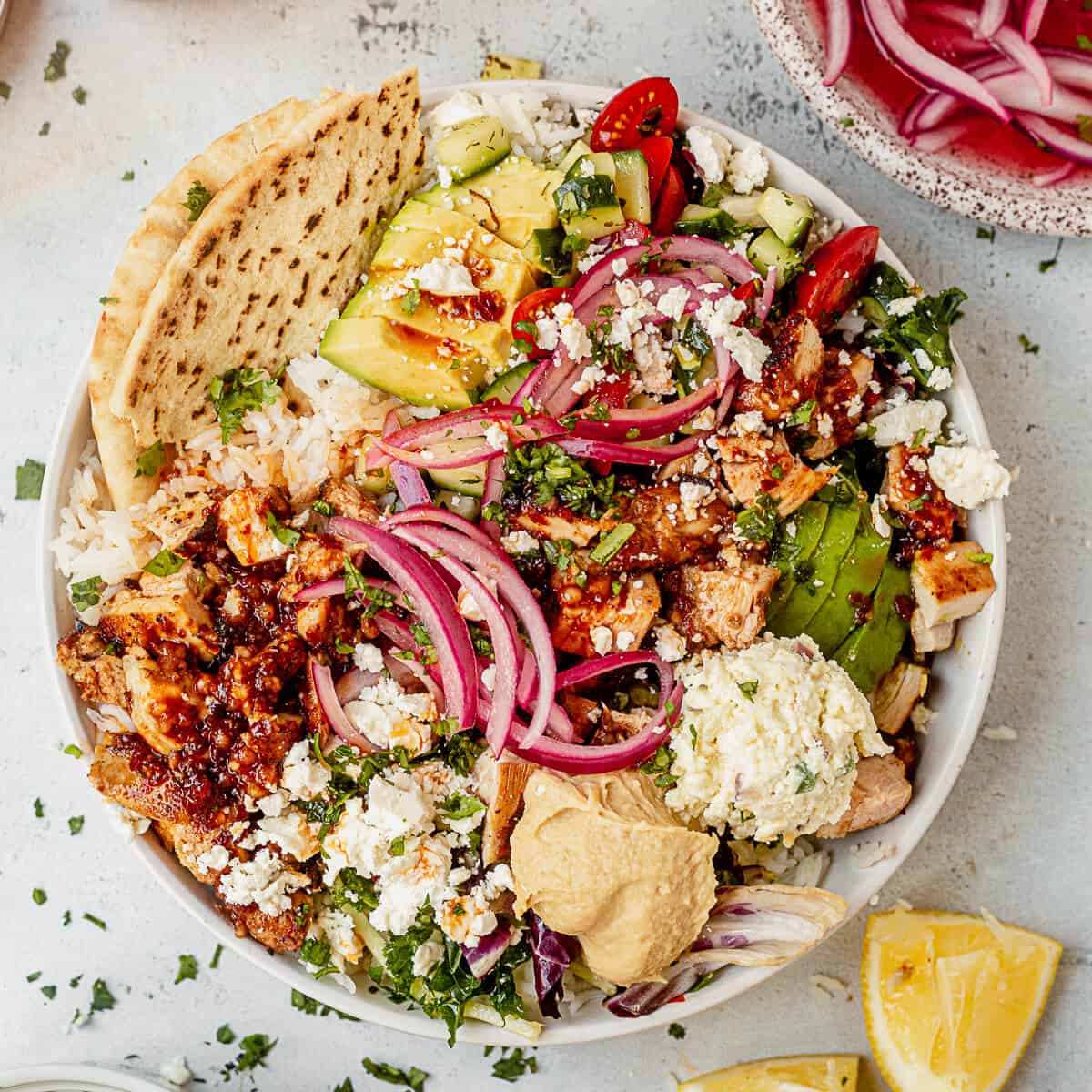 CAVA signature dishes  Build-Your-Own Bowls (with bases like saffron rice or salad), Harissa Honey Chicken, Spicy Lamb Meatballs, various dips and spreads (e.g., Crazy Feta, Hummus).
